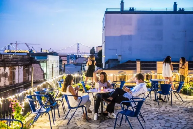 A vibrant Lisbon street with colourful cafés and hipster markets